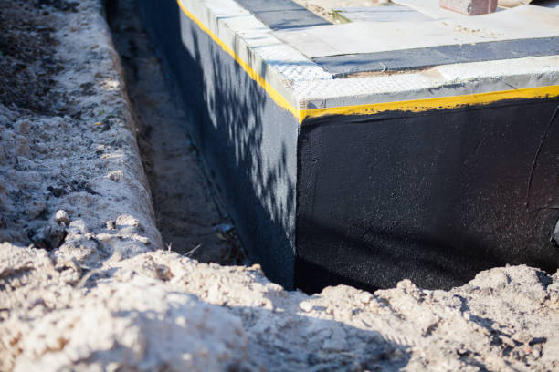 Professional Basement Waterproofing technician working in Brookeville, MD